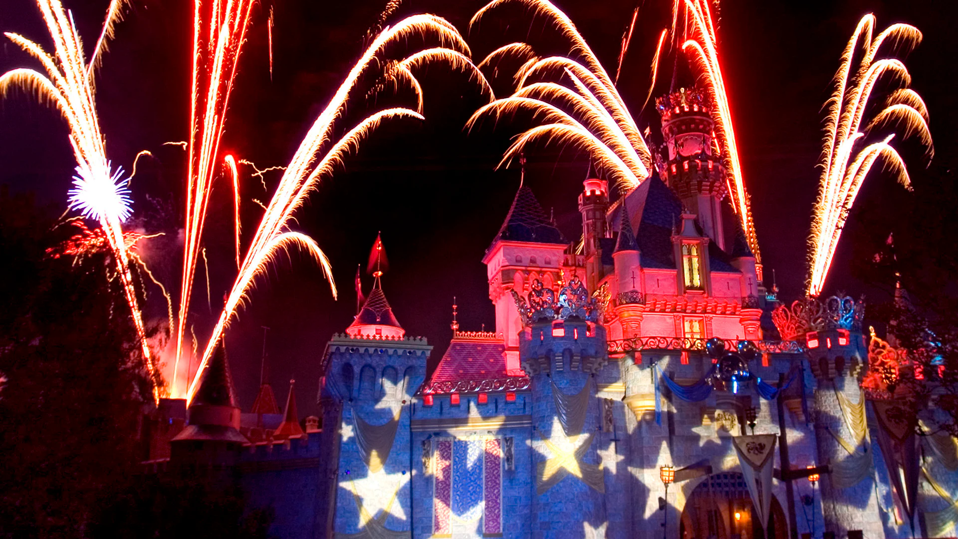 Fireworks bursting over Sleeping Beauty Castle at Disneyland park. | CREDIT: Disney