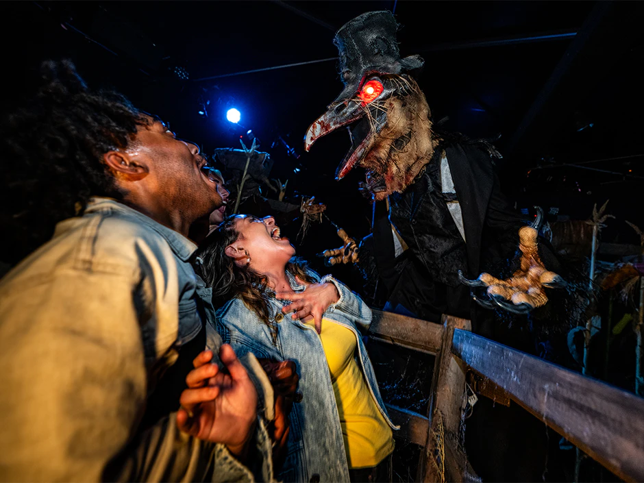 Performers in costume roam a fog-filled street during Halloween Horror Nights at Universal Studios Hollywood. | CREDIT: Universal Studios Hollywood