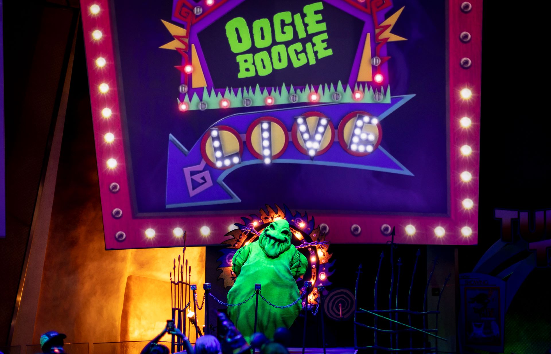 Oogie Boogie appears on stage beneath the Oogie Boogie Live marquee at Disney California Adventure Park. | CREDIT: Disney
