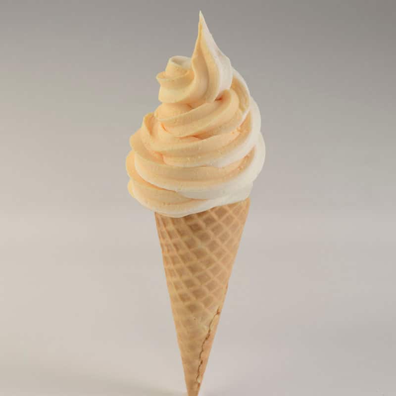 Vanilla and DOLE Whip® Orange Swirl Waffle Cone