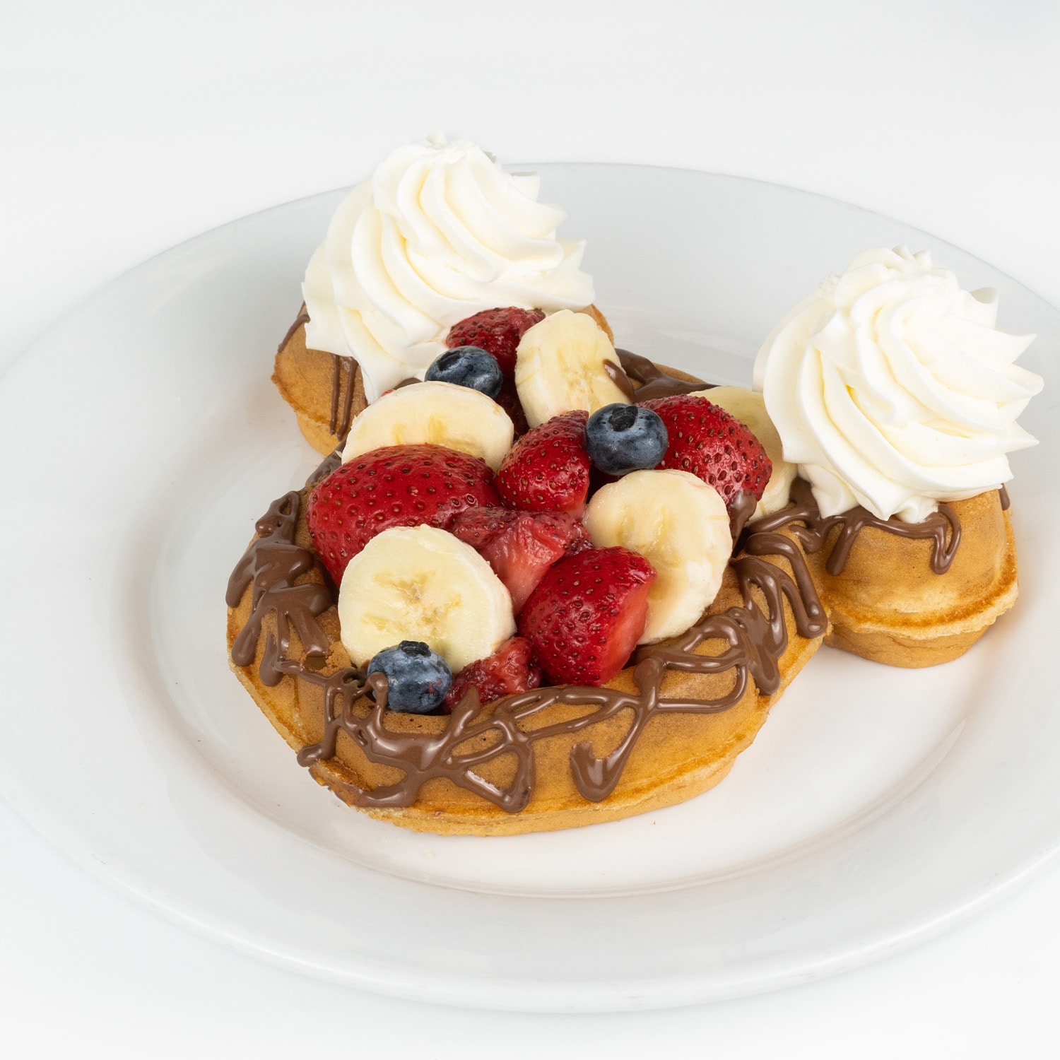 Waffle with Chocolate-Hazelnut Spread, Bananas, Berries, and Whipped Cream